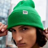 Man wearing green TIFF beanie