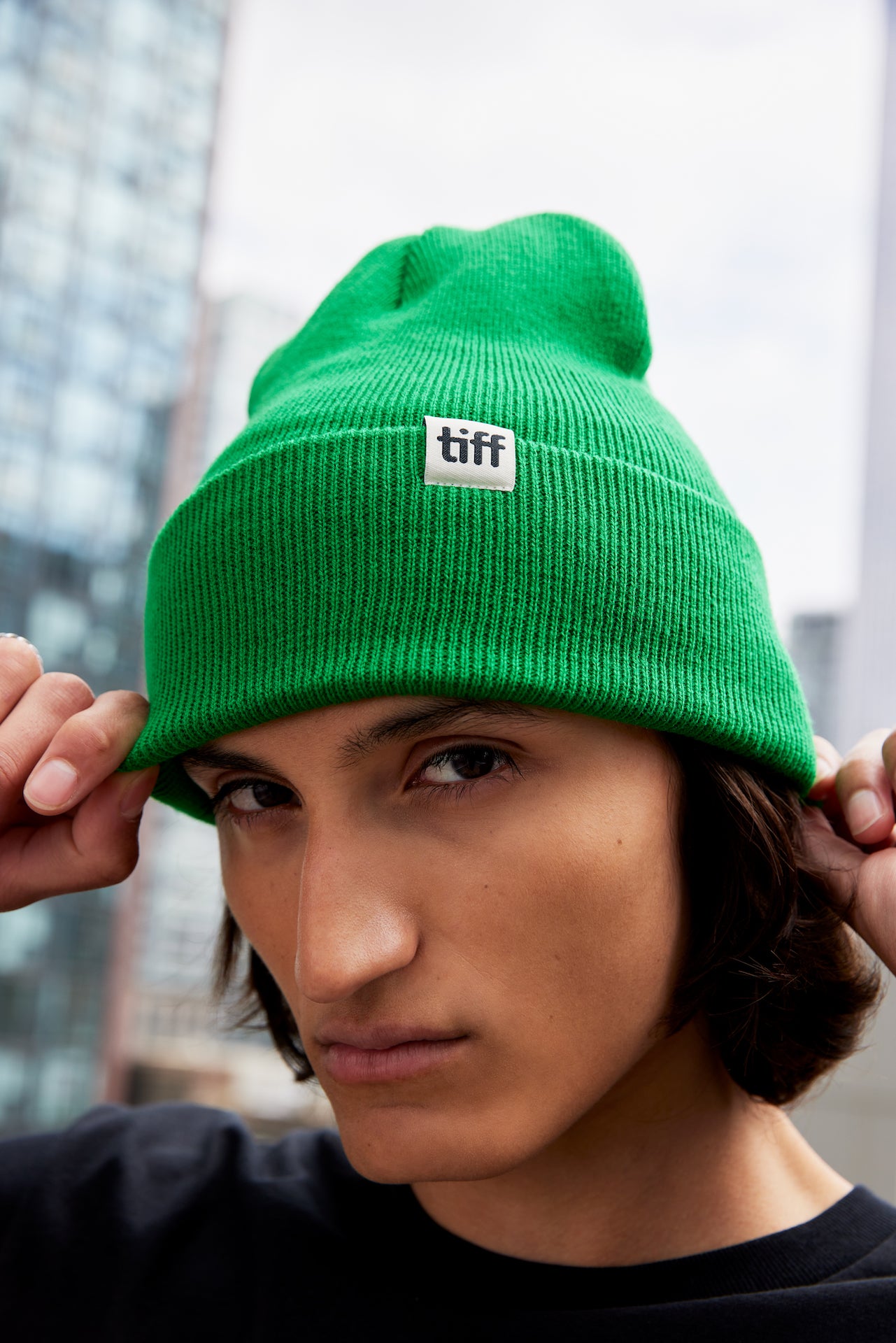 Man wearing green TIFF beanie
