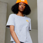 Woman in grey TIFF t-shirt and orange toque