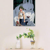 A framed art print puzzle of Princess Mononoke standing with Moro the wolf god hangs on a wall above a small wooden floating shelf.


