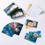 A flat lay display of a "My Neighbor Totoro" stationery set featuring illustrated notecards and tan envelopes.