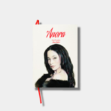 An illustrated book cover for Sean Baker's original screenplay Anora, featuring a stylized portrait of a woman with long dark hair and a fur coat against a white background with red typography.