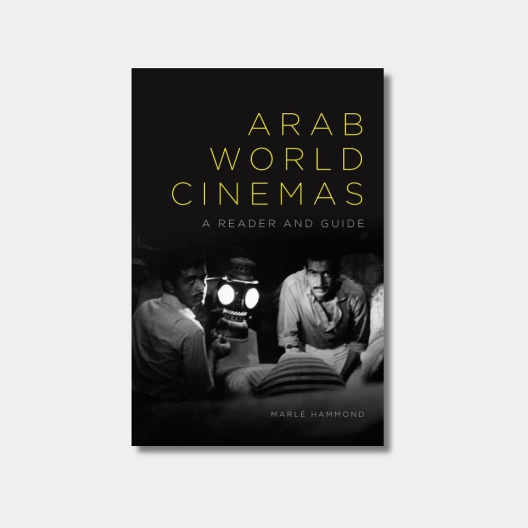 The book cover for "Arab World Cinemas: A Reader and Guide" features the title in a thin, yellow sans-serif font against a black background. Below the title is a black-and-white photograph showing two men in a dark setting, one of whom is operating a vintage film projector that is emitting a bright light.
