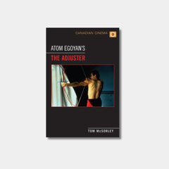 Book cover featuring a framed central image of a shirtless man with his back to the camera, looking at a structure. The title is written in white and red text above the image, with the author's name at the bottom.