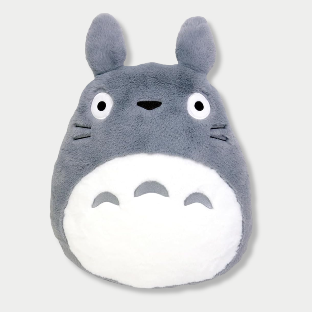 A flat plush toy of the gray Totoro character from Studio Ghibli, featuring a white belly with crescent markings, pointed ears, and wide round eyes against a light gray background.