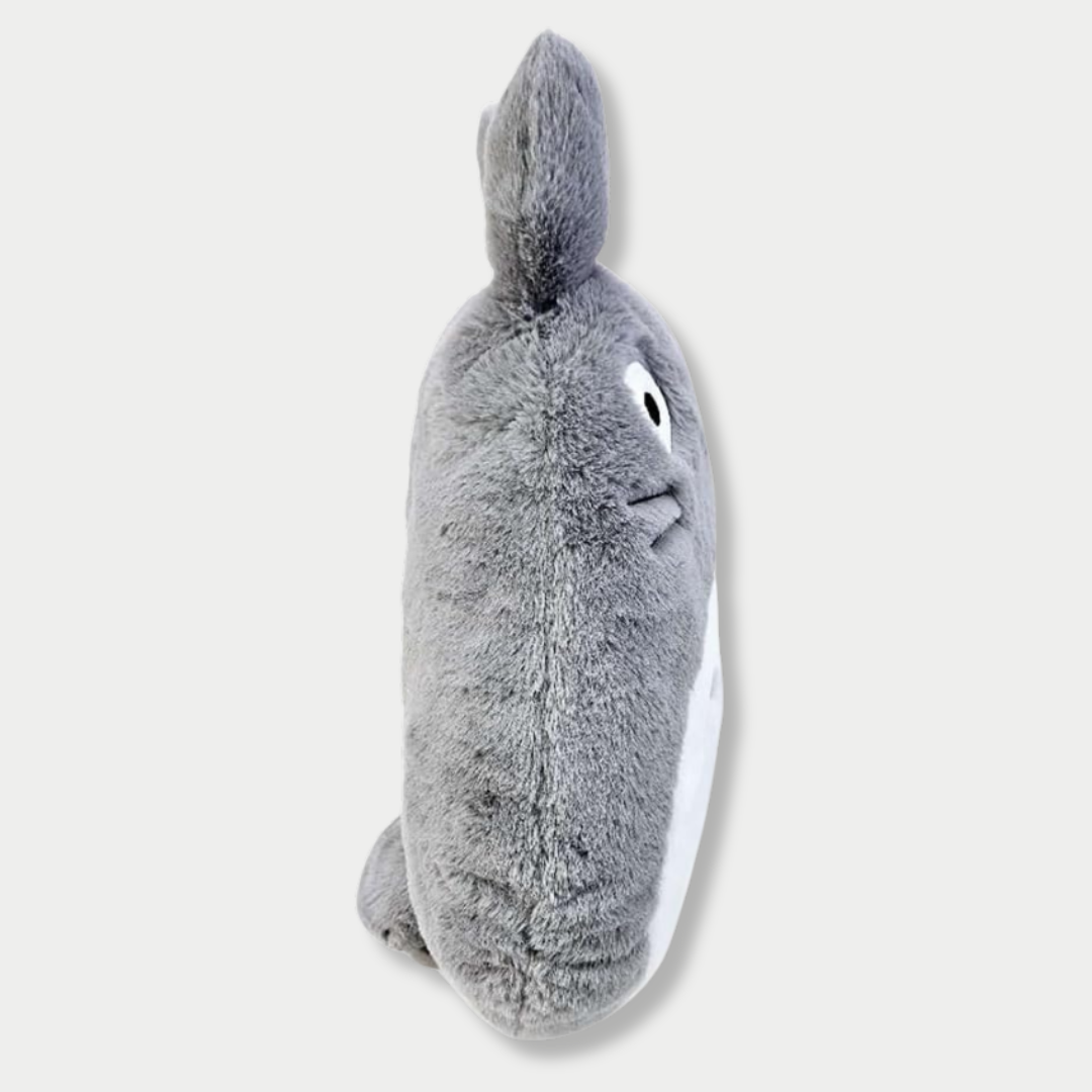 Side view of a flat plush toy of the gray Totoro character from Studio Ghibli, featuring a white belly with crescent markings, pointed ears, and wide round eyes against a light gray background.