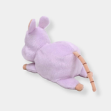 Purple mouse plush with small ears, stitched tail, and light pink accents, shown from the side.