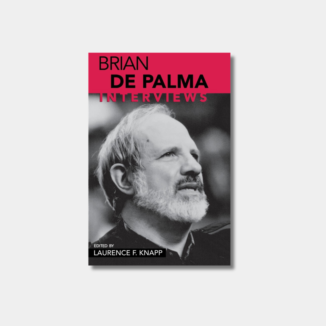 A book cover for "Brian De Palma: Interviews" featuring a large black-and-white portrait of a bearded Brian De Palma looking upward, with a bold pink banner at the top containing the title.