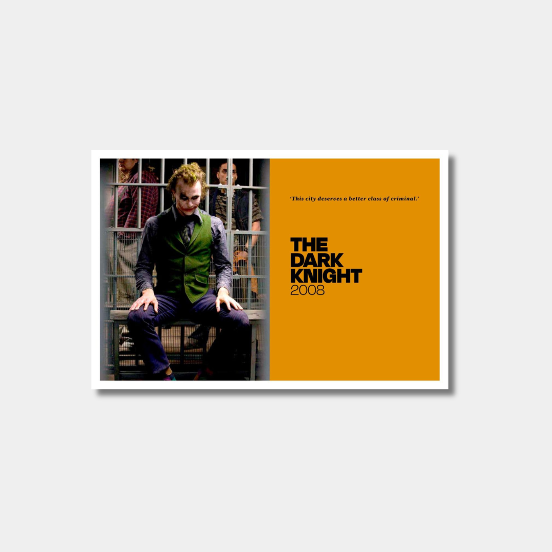 A minimalist movie poster for "The Dark Knight" (2008) featuring a split design: on the left, a photo of the Joker sitting in a jail cell, and on the right, a solid orange background with the film's title, year, and the quote, "This city deserves a better class of criminal."
