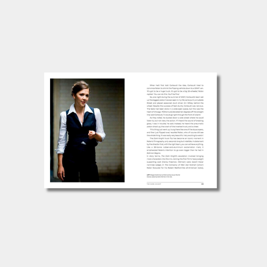 An open book spread featuring a full-page photograph of Maggie Gyllenhaal as Rachel Dawes from "The Dark Knight" on the left and a page of text discussing the film's production and stunts on the right.