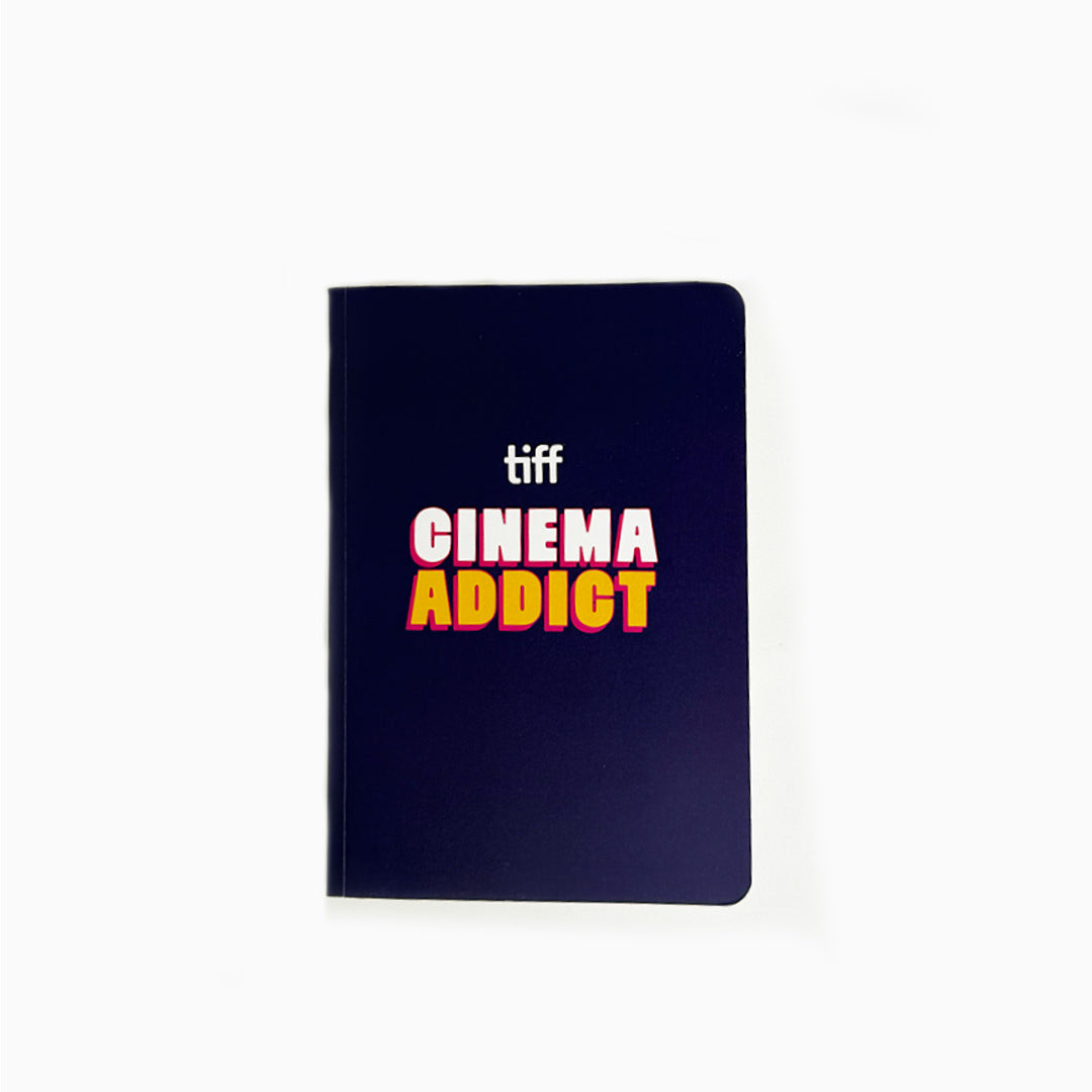 Notebook with 'tiff Cinema Addict' text on a white background