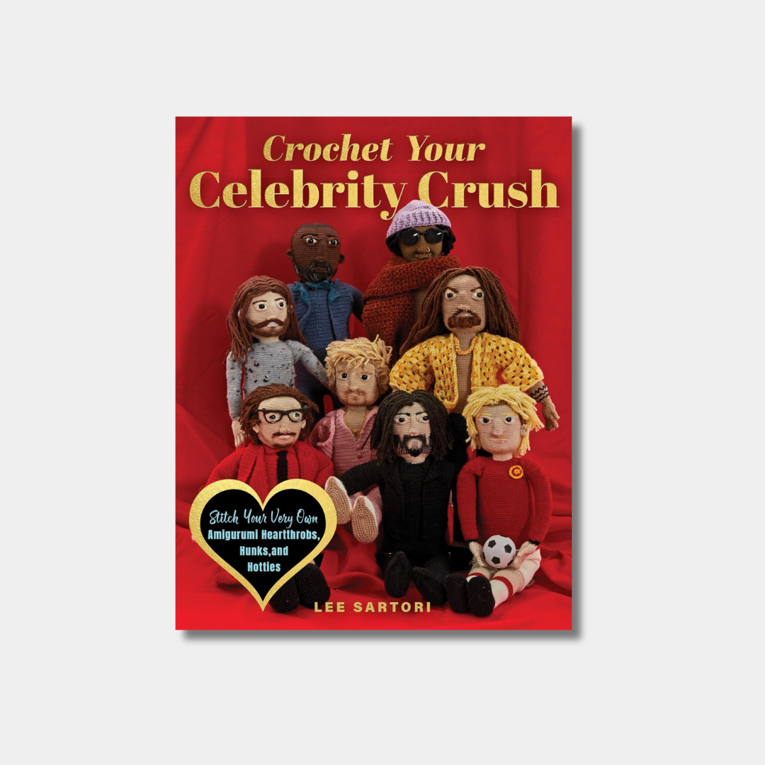 A book cover for "Crochet Your Celebrity Crush" featuring a collection of amigurumi dolls resembling famous actors and musicians, such as Keanu Reeves and Kurt Cobain, posed against a vibrant red background with a yellow heart-shaped badge.