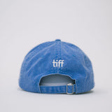 Back view of a blue baseball cap on a white background, featuring white “TIFF” embroidery on the back.