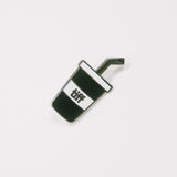 Black and white soda cup shaped enamel pin with the TIFF logo at center on a white background.