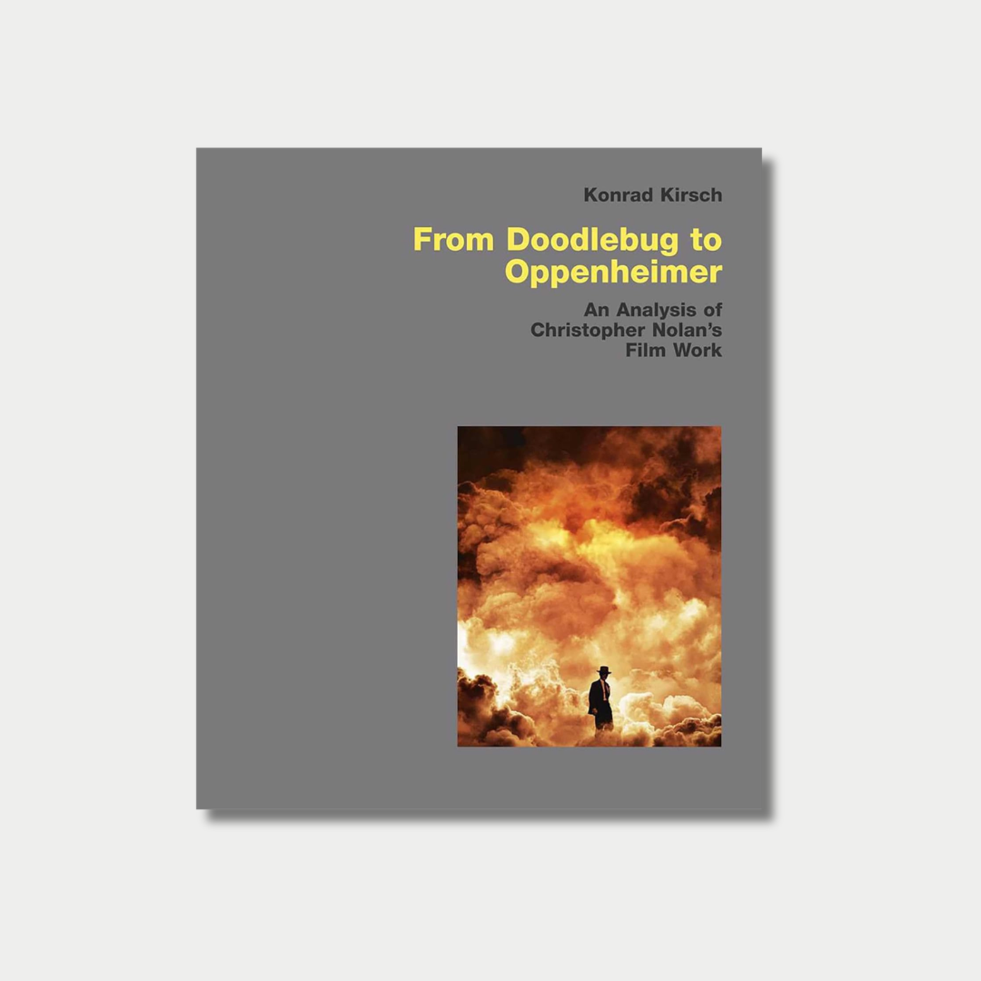 Book cover of "From Doodlebug to Oppenheimer: An Analysis of Christopher Nolan's Film Work" by Konrad Kirsch, featuring a gray background with yellow and black text alongside an image of a silhouetted man standing before a massive, fiery explosion.