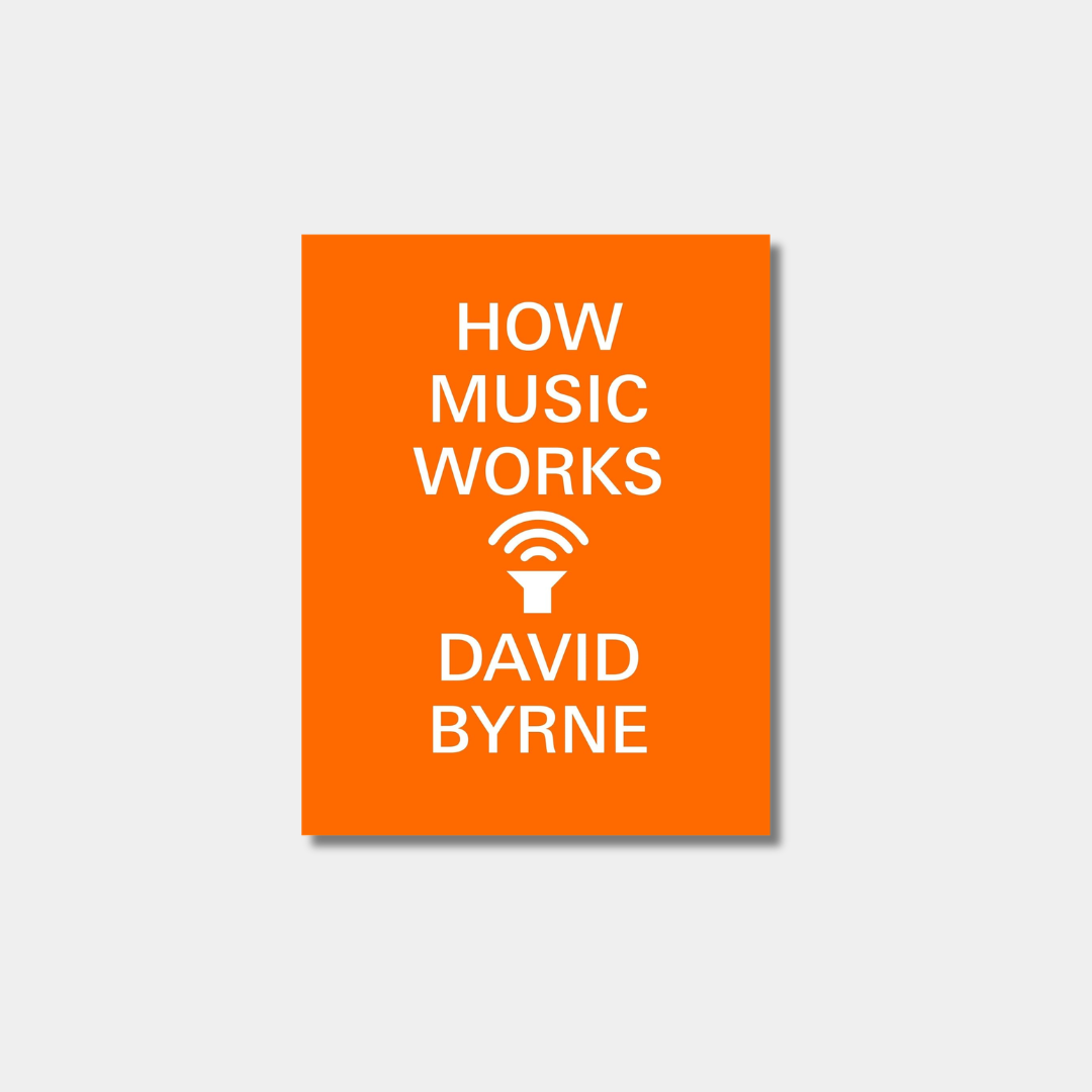 The image shows the orange book cover of "How Music Works" by David Byrne, featuring the title and author's name in white text above and below a central white icon of a gramophone horn with sound waves.