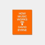 The image shows the orange book cover of "How Music Works" by David Byrne, featuring the title and author's name in white text above and below a central white icon of a gramophone horn with sound waves.