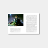 An open book spread featuring a photograph from the film Aliens on the left page and a full page of descriptive text on the right.