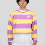 A model wears a long-sleeved cropped shirt featuring yellow, purple, and white stripes with the "TIFF" logo printed on the chest.