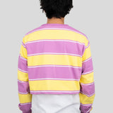Back of model wearing a long-sleeved cropped shirt featuring yellow, purple, and white stripes.