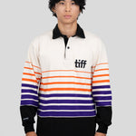 A model wears a long-sleeved, collared rugby shirt featuring orange, purple, and black stripes with the "TIFF" logo printed on the left chest.
