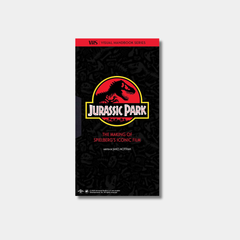 The book cover for "Jurassic Park: The Making of Spielberg's Iconic Film" by James Mottram features the movie's classic T-Rex skeleton logo centered on a black background patterned with subtle dinosaur fossils.
