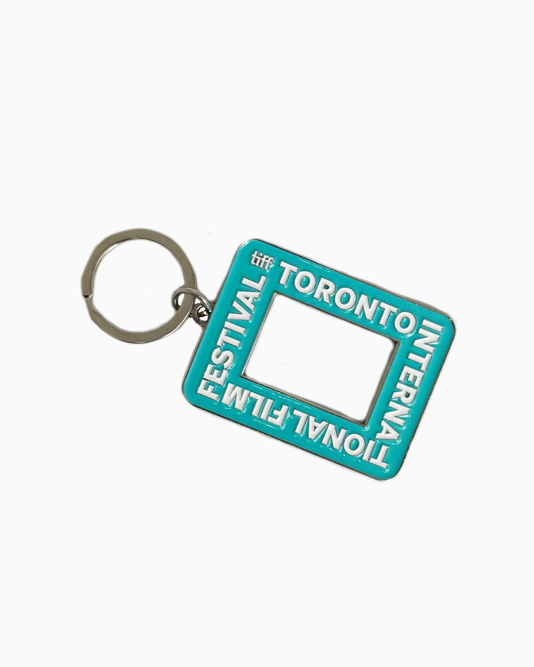 A teal rectangular enamel keychain featuring the Toronto International Film Festival logo and a cutout center resembling a camera viewfinder.