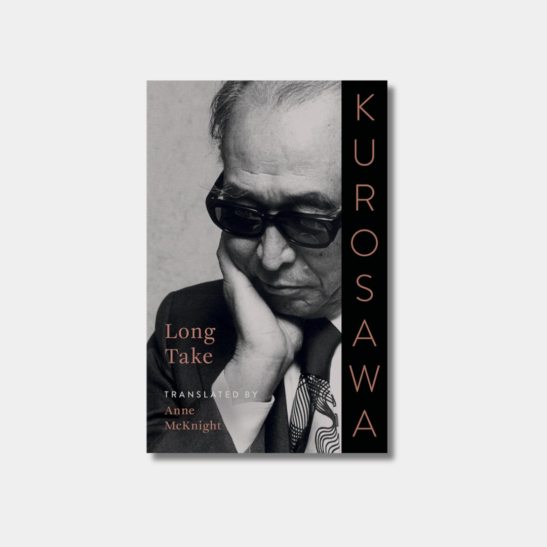 The cover of the book Kurosawa: Long Take features a black-and-white portrait of filmmaker Akira Kurosawa wearing sunglasses and resting his chin on his hand.