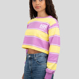 A model wears a long-sleeved cropped shirt featuring yellow, purple, and white stripes with the "TIFF" logo printed on the chest.
