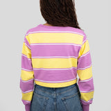 Back of model wearing a long-sleeved cropped shirt featuring yellow, purple, and white stripes.
