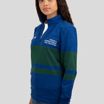 A model wears a blue and dark green quarter-zip pullover featuring "EST. 1976" and "TORONTO INTERNATIONAL FILM FESTIVAL" printed on the chest.