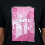 A black short-sleeve crewneck t-shirt featuring a large pink graphic print on the front with the text 'To Intl Film Fest' and a stylized Toronto skyline, worn by a model.