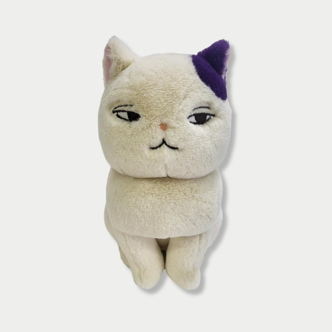 A seated off-white cat plush toy with a distinct purple patch on its left ear, featuring half-lidded, cynical eyes and a small embroidered mouth against a plain light background.