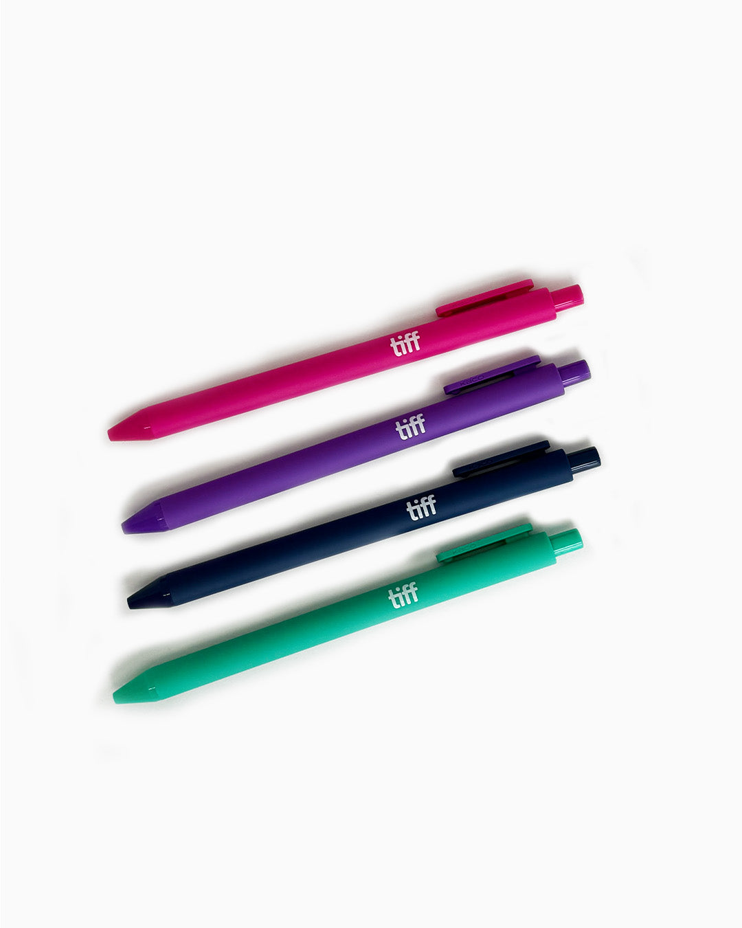 A set of four pens in pink, purple, navy, and teal.