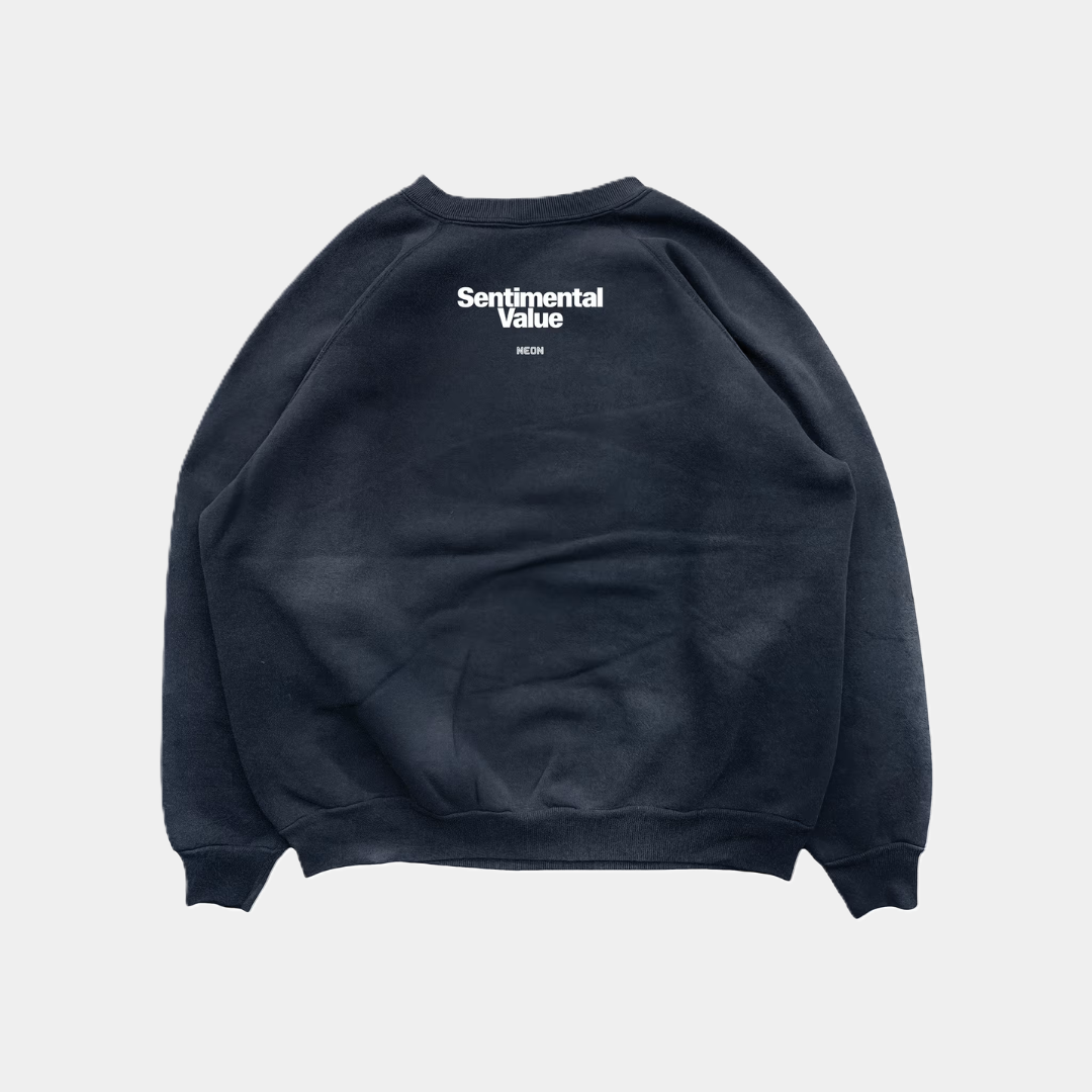 Back view of a black raglan-style sweatshirt featuring the words "Sentimental Value" and "NEON" printed in white centered below the back neckline.