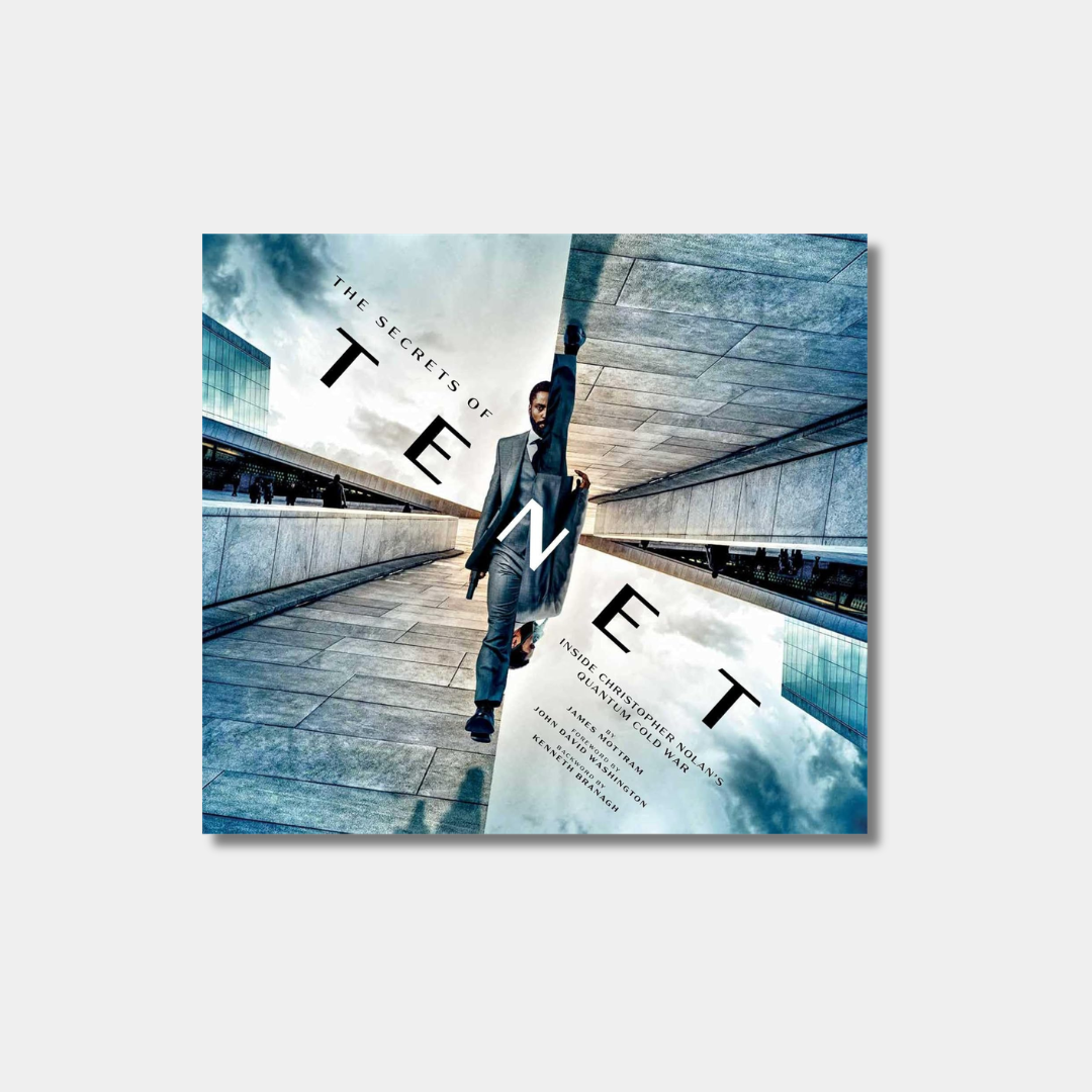 The book cover for "The Secrets of Tenet: Inside Christopher Nolan's Quantum Cold War" by James Mottram features a man in a suit walking through a futuristic, geometric landscape with the movie title "TENET" prominently displayed in large, stylized letters.