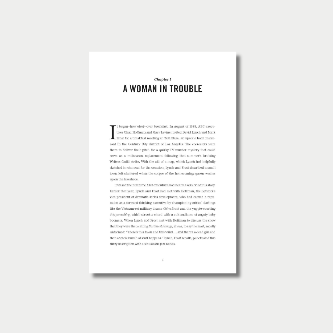 An open book spread displaying two pages of text from Chapter 1, titled "A Woman in Trouble," featuring a large drop cap at the beginning of the chapter on the left page.