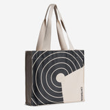 Tote bag with circular pattern and beige accents on a white background