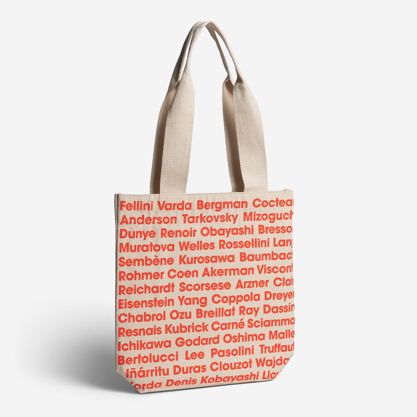 Beige tote bag with red text on a white background