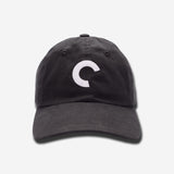 Black cap with a white logo on a light gray background
