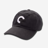 Black cap with a white logo on a light gray background