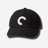 Black cap with a white logo on a light gray background