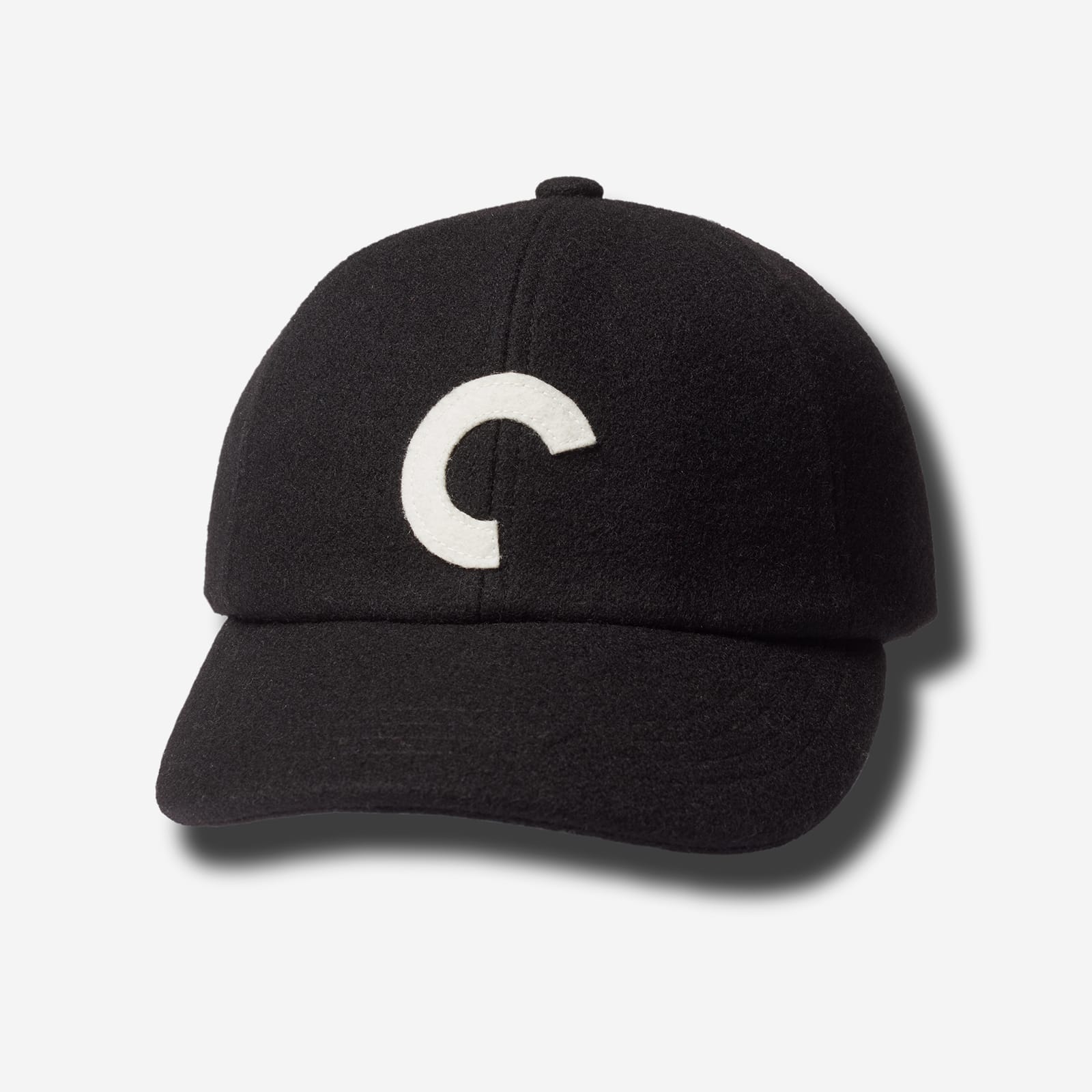 Black cap with a white logo on a light gray background