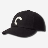 Black cap with a white logo on a light gray background