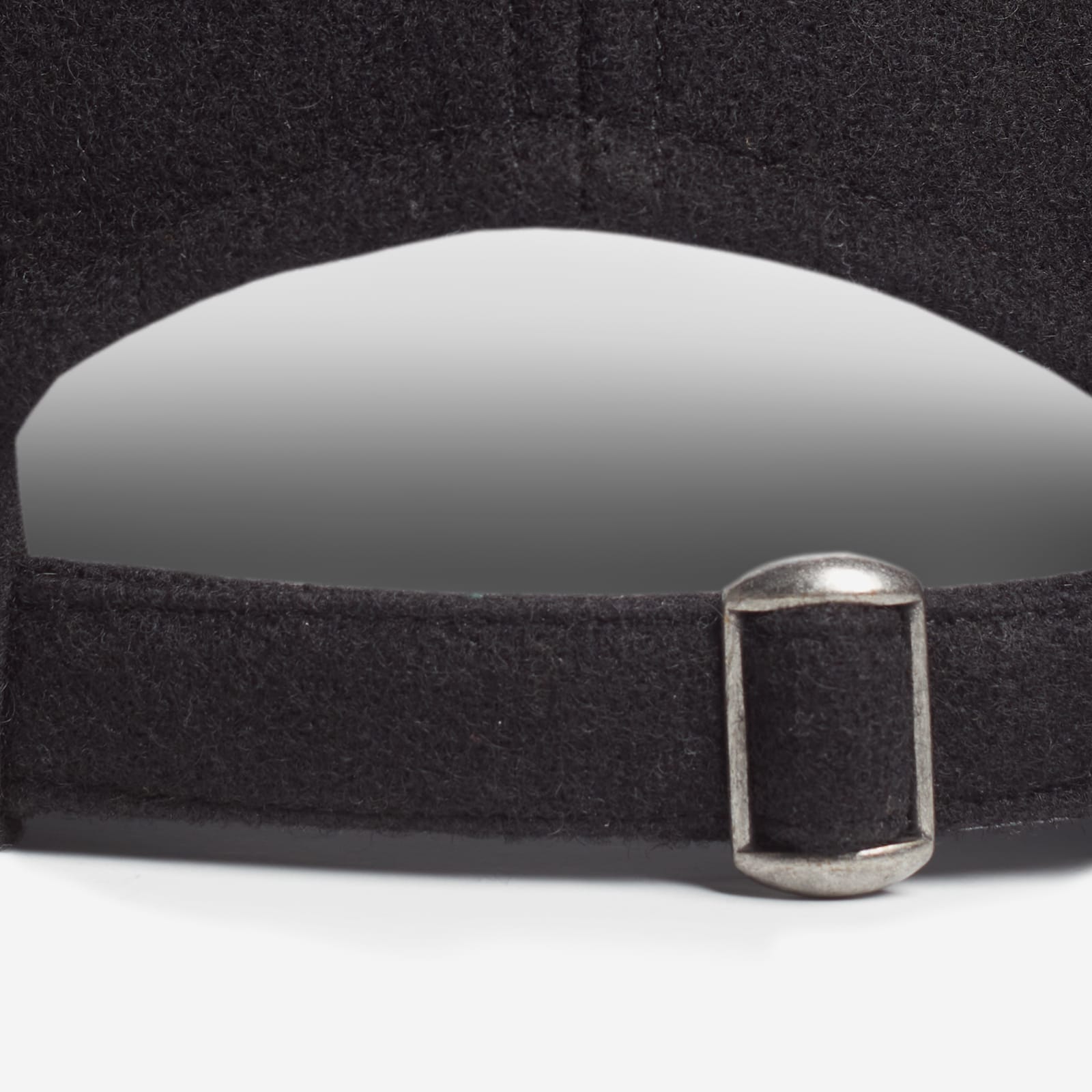 Back of hat - Black belt with a silver buckle on a white background