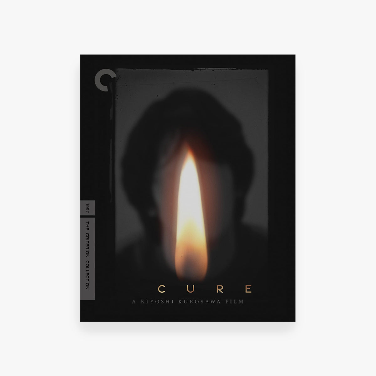 Blu-Ray cover for 'Cure' by Kiyoshi Kurosawa with a candle flame design.