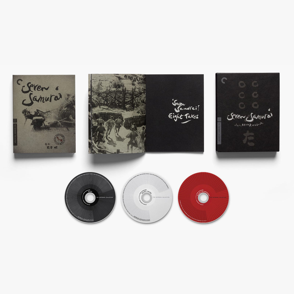 Collection of 'Seven Samurais' DVD cases and discs on a white background