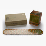 Collection of 'The Wes Anderson Archive' books and discs on a white background