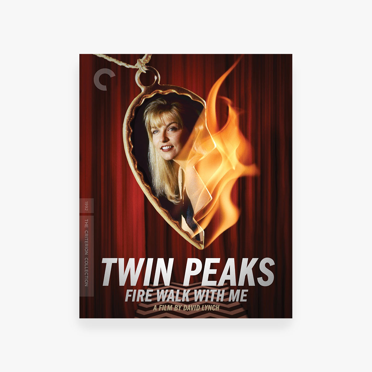 DVD cover of 'Twin Peaks: Fire Walk with Me' featuring a woman's face in a heart-shaped frame with flames.