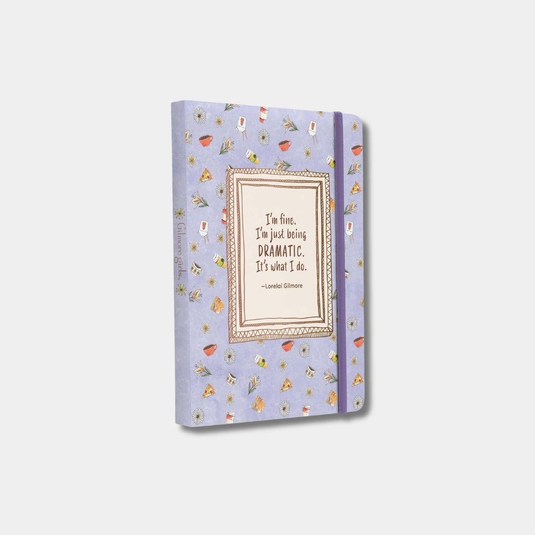 The light purple notebook features a pattern of small coffee mugs and flowers, with a framed quote in the center that reads, "I'm fine. I'm just being DRAMATIC. It's what I do. —Lorelai Gilmore."
